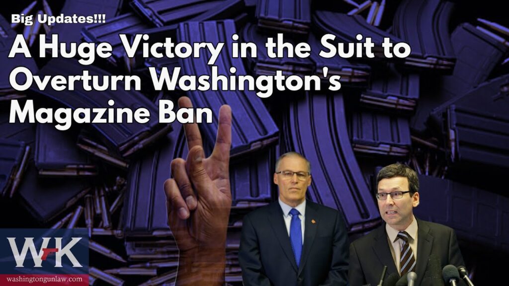 A hand showing a victory sign appears in the foreground. The background is filled with rifle magazines. Two men are shown, wearing suits. Text reads: "Big Updates!!! A Huge Victory in the Suit to Overturn Washington's Magazine Ban." Logos are at the bottom.