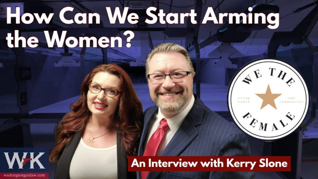 A woman and a man in business attire stand smiling in front of a shooting range. Text reads, "How Can We Start Arming the Women?" and "An Interview with Kerry Slone." A circular logo says "We The Female.