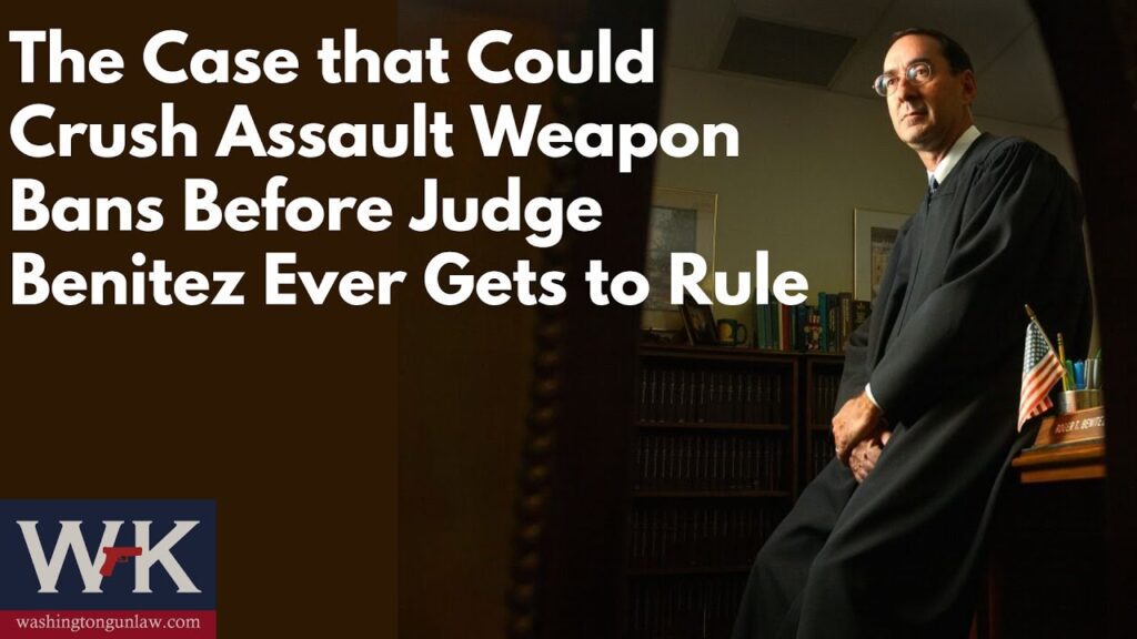 A judge in a courtroom is seated in front of a bookshelf, dressed in a black robe. The text on the image reads, "The Case that Could Crush Assault Weapon Bans Before Judge Benitez Ever Gets to Rule." At the bottom left is a logo for Washington Gun Law.
