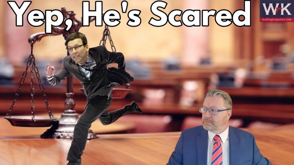 A man in a suit, appearing to run scared, is superimposed on a courtroom scene with scales of justice in the background. Another man in a suit and glasses sits at a table, looking on. Text reads, "Yep, He's Scared.
