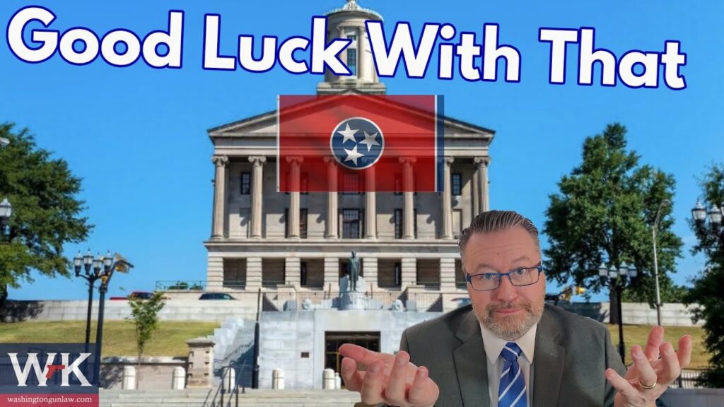 A man in a suit and tie gestures with open hands in front of a large building with columns. The Tennessee state flag is superimposed, and the text "Good Luck With That" appears at the top. Trees and a clear sky are in the background.