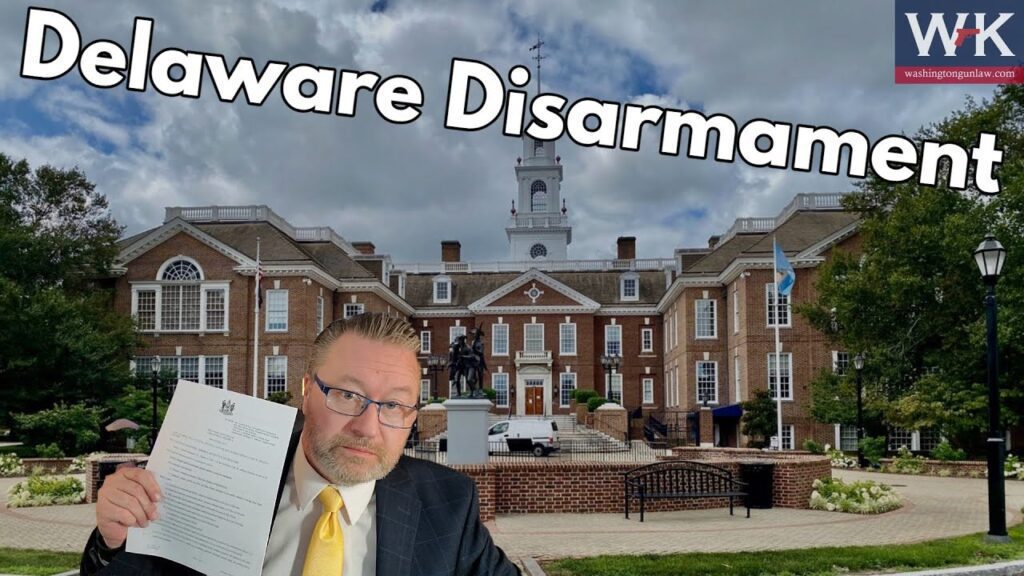 A man in a suit holds up a document in front of an impressive brick building with a clock tower and statue. The sky is partly cloudy. The text "Delaware Disarmament" is at the top.