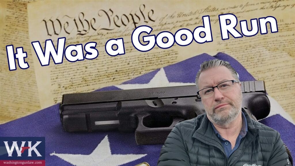 A man with glasses and a beard stands in front of a collage featuring a handgun, a section of the U.S. Constitution, and a blue flag. The text reads, "It Was a Good Run." A logo in the corner shows "W&K" and "washingtongunlaw.com.