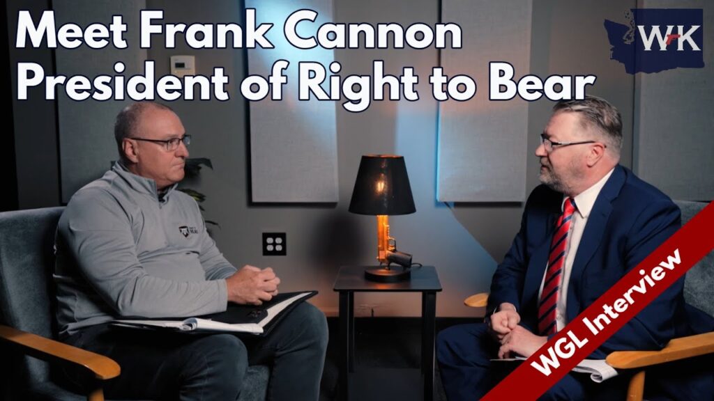 Two men are seated in a studio setting for an interview. One, in a gray shirt, holds a clipboard, while the other, in a suit, speaks. A lamp and a potted plant are in the background. Text reads, "Meet Frank Cannon, President of Right to Bear.