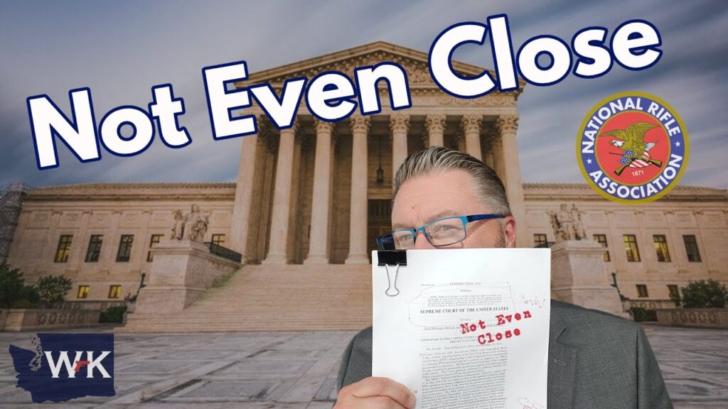 Man holding a document labeled "Not Even Close" in front of the U.S. Supreme Court building. The words "Not Even Close" and the National Rifle Association logo are prominent. The initials "WK" are in the bottom left corner.