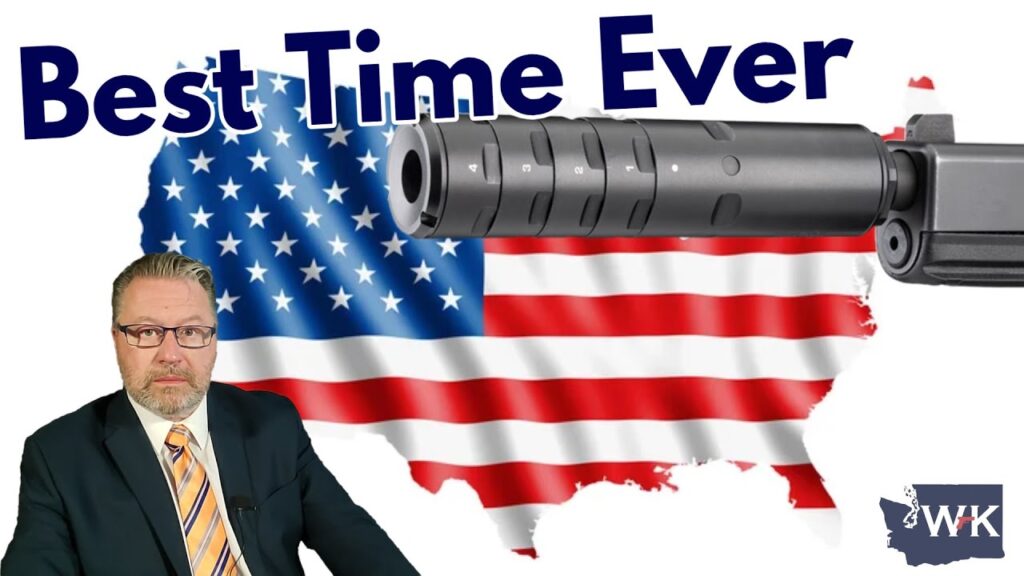 A man in a suit and tie is in front of a U.S. map with an American flag pattern. There's a large gun barrel pointing across the image. The words "Best Time Ever" are displayed at the top. A small logo "WK" is in the bottom right.
