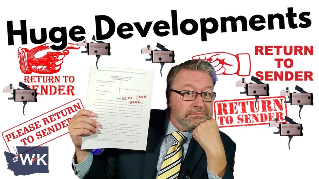 A man in a suit holds a document in front of a background filled with "Return to Sender" stamps. The words "Huge Developments" are prominently displayed at the top. He appears contemplative, resting his chin on one hand.