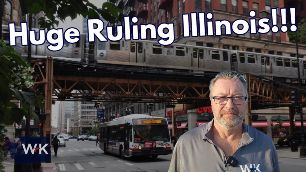 A man stands in front of an elevated train track with a train passing by in an urban setting. A bus is on the street nearby. Text on the image reads, "Huge Ruling Illinois!!!" and "WK.