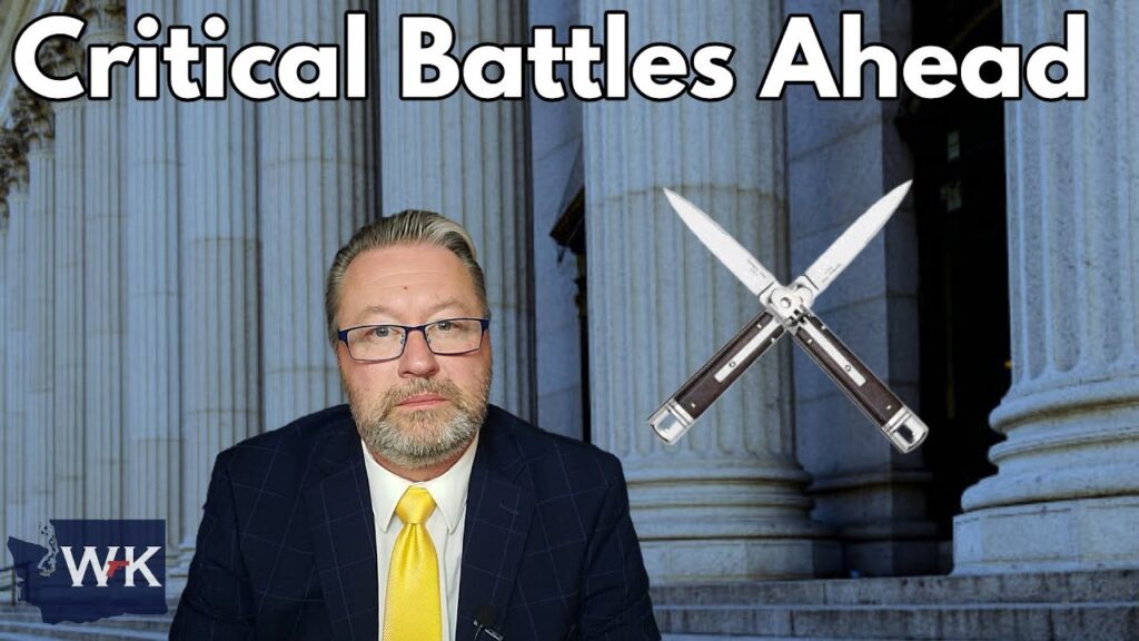 A man in a suit and yellow tie stands in front of a building with large columns. Text above him reads "Critical Battles Ahead." Two pocket knives are crossed in the background.