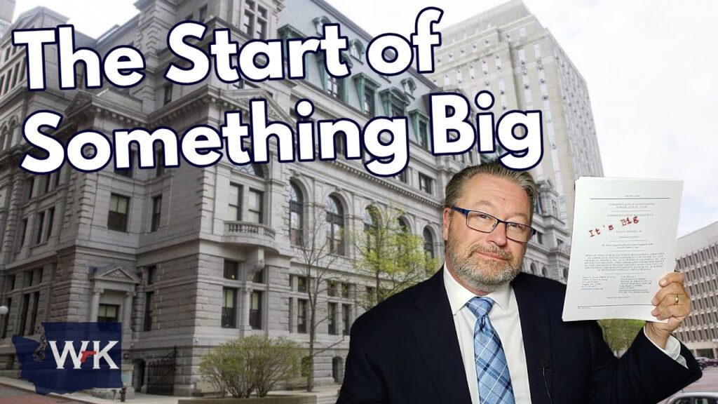 A man in a suit holds up a piece of paper with text. The backdrop is a large, older-style building. The words "The Start of Something Big" are prominently displayed in bold letters.