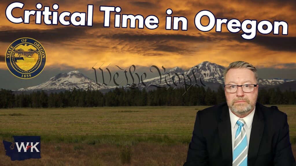 A man in a suit and tie is sitting against a backdrop of mountains and a sunset sky. The text reads "Critical Time in Oregon" and the Oregon state seal is visible. The initials "WK" are in the bottom left corner.