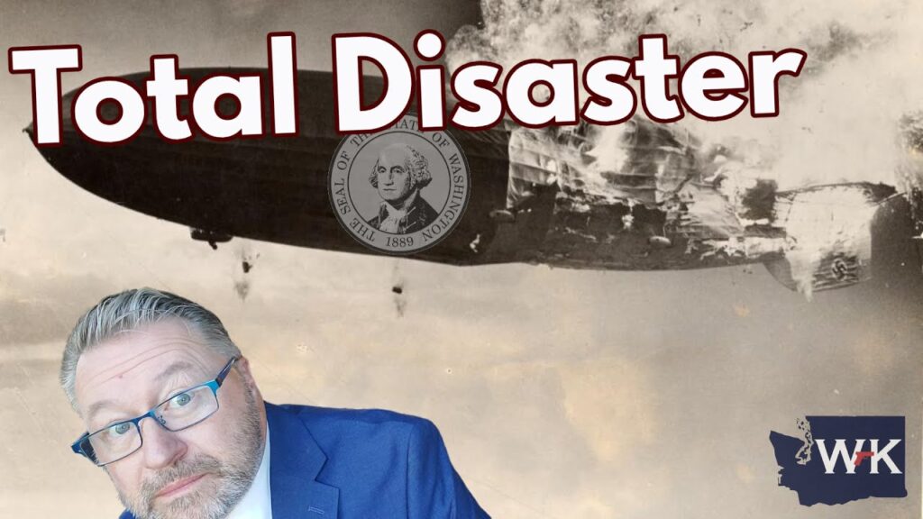 Black and white image of a burning airship with the words "Total Disaster" in bold letters. Below, a man in a blue suit with glasses looks at the camera. A state seal and map icon are also visible on the image.