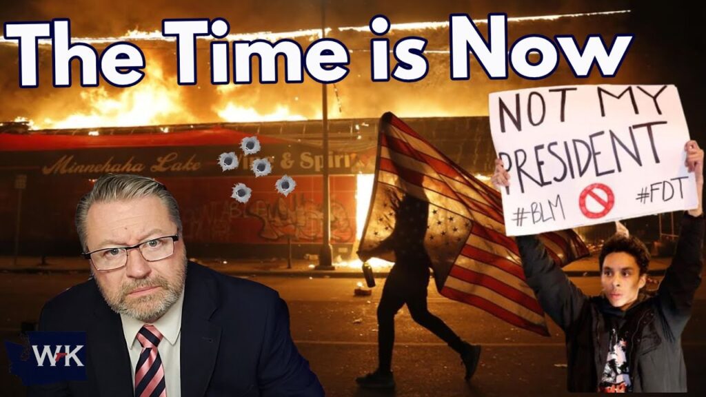 A man in a suit looks serious while standing in the foreground. In the background, there is a large fire, a damaged bus, someone holding a U.S. flag, and a protester with a "Not My President" sign. Bullet holes are visible on the bus window.