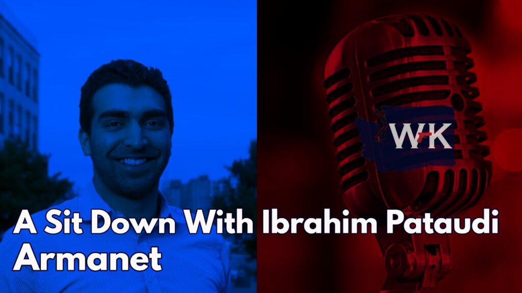 Split-screen image: On the left, a person smiles against a city skyline backdrop, tinted blue. On the right, a close-up of a vintage microphone, tinted red, with the letters "WK." Text reads: "A Sit Down With Ibrahim Pataudi Armanet.