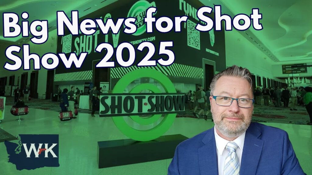 A man in a suit sits in front of a large "SHOT SHOW" sign at an indoor event. The text on the image reads "Big News for Shot Show 2025" alongside a logo with the letters "WFK." People are visible in the background.
