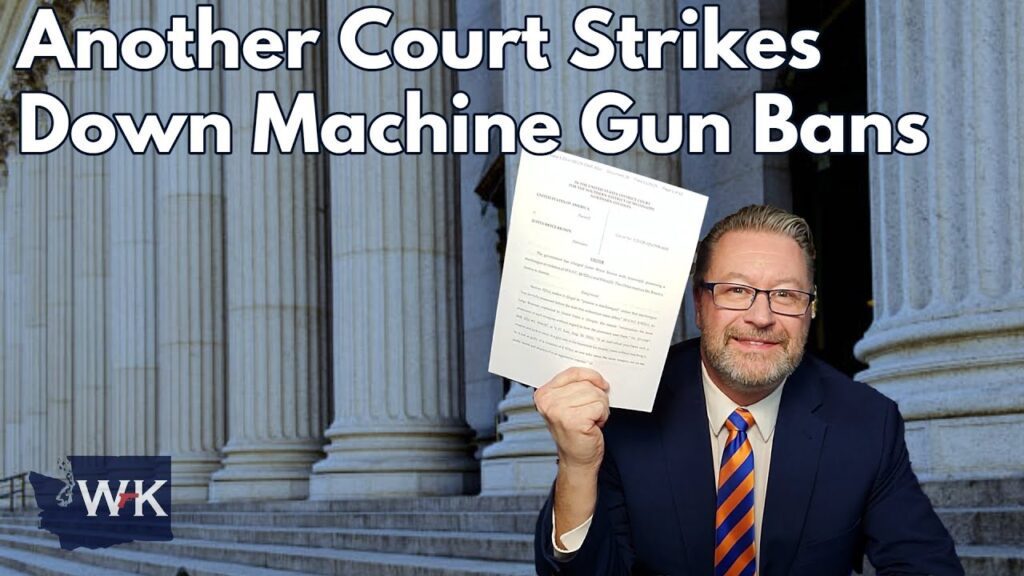 A man in a suit holds up a legal document, smiling in front of large stone columns. The text reads, "Another Court Strikes Down Machine Gun Bans." A logo in the corner displays the letters "WK.
