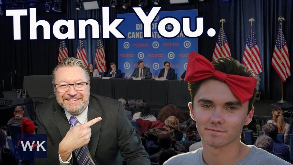 A smiling man in a suit points to a person with a large red bow on their head. In the background, a panel sits at a table with "POLITICO" logos and American flags. Large text reads "Thank You." An audience is seated in front of the panel.
