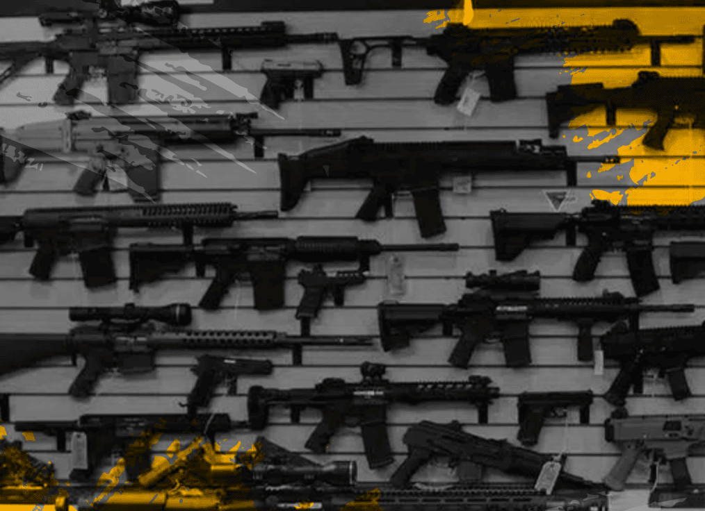 A display of various rifles and firearms mounted on a slatted wall. The image is overlaid with yellow and gray abstract brush strokes, adding an artistic effect to the scene.
