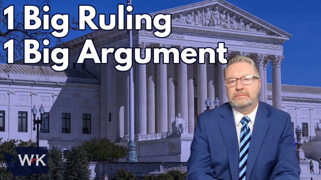 A man in a blue suit and striped tie sits in front of an image of a large neoclassical building. The text reads "1 Big Ruling, 1 Big Argument" in white letters.