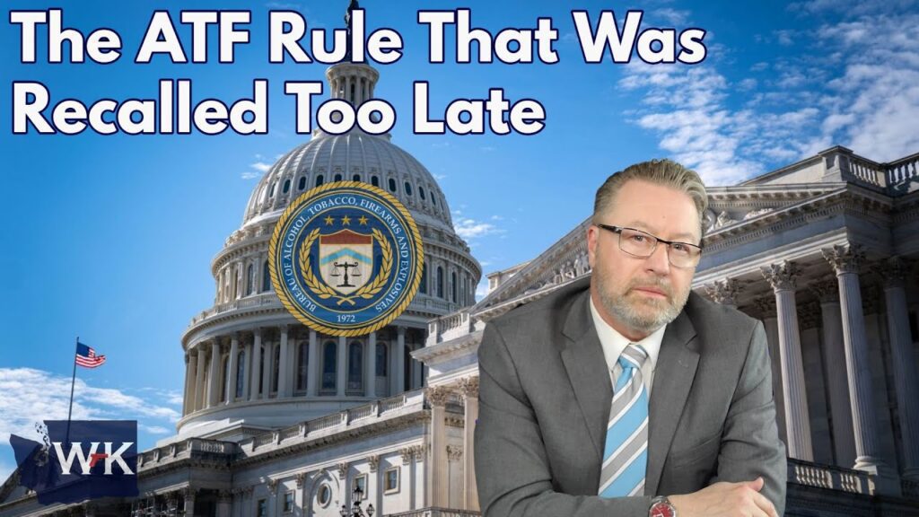 A man in a suit sits in front of the U.S. Capitol building with the ATF seal beside him. The text reads: "The ATF Rule That Was Recalled Too Late." The sky is blue with clouds, and a U.S. flag is visible.