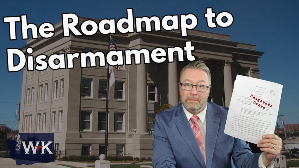 A man in a blue suit and glasses holds up a document in front of a government building. Large text reads “The Roadmap to Disarmament.” An American flag is visible. The WK logo appears in the lower left corner.
