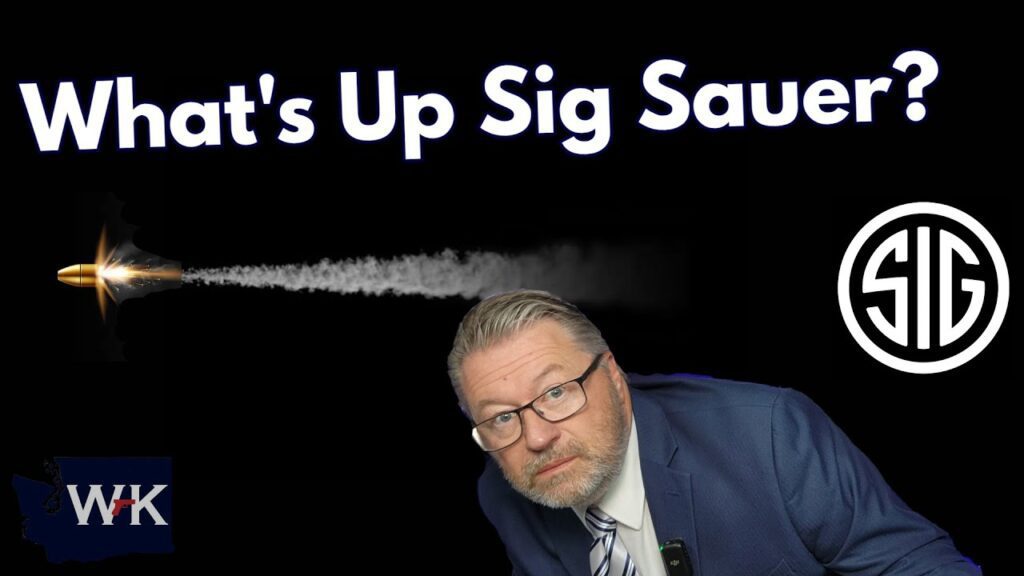 A man in a blue suit and glasses looks at the camera. A bullet with a smoke trail is fired toward a white "SIG" logo. The text above reads "What's Up Sig Sauer?" on a black background. A logo with the letters "WK" is in the corner.