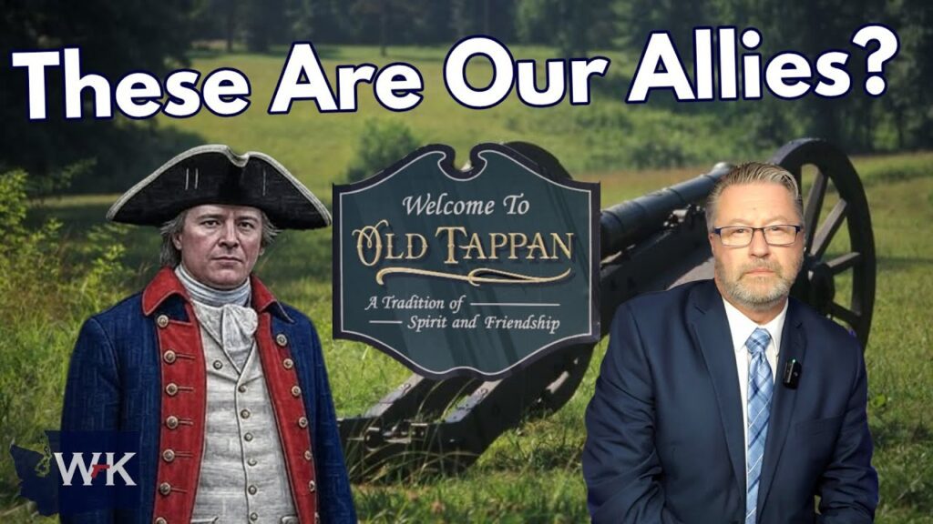 A man in a Revolutionary War uniform and another in a suit stand by a cannon and a sign reading "Welcome to Old Tappan" on a grassy field, with large text above: "These Are Our Allies?.