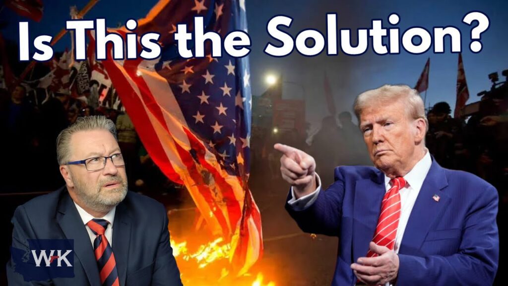 A man in a suit and glasses looks thoughtful as he sits in the foreground; behind him, Donald Trump points forward. An American flag burns amid a crowd. Text at the top reads, “Is This the Solution?”.