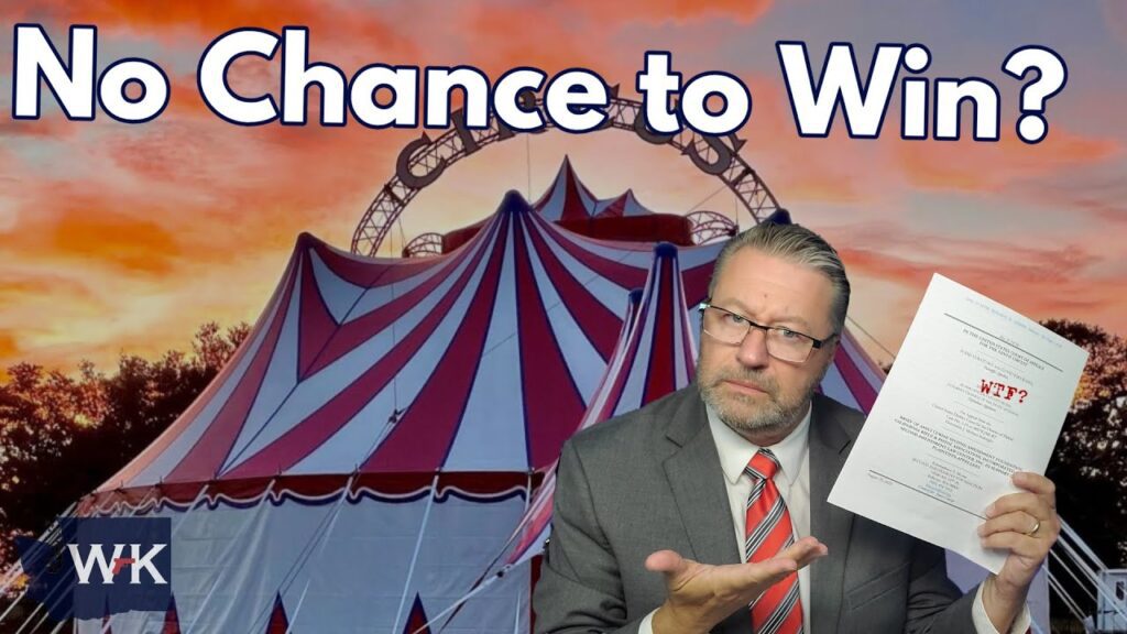 A man in a suit and tie holds up papers labeled "WTF?" and gestures with his other hand. Behind him is a red and white circus tent at sunset. Large text reads, "No Chance to Win?" in the sky above.
