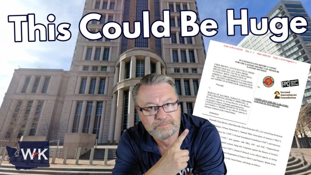 A man with glasses and a beard points at a legal document, with a large courthouse building in the background. The text "This Could Be Huge" appears at the top of the image.