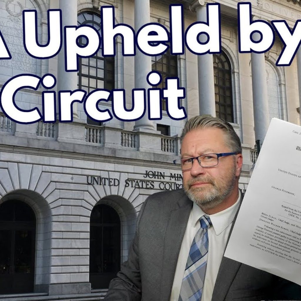 A man in a suit holds up legal documents in front of a courthouse. Large text reads, "NFA Upheld by 5th Circuit." The WK logo is at the bottom left corner.