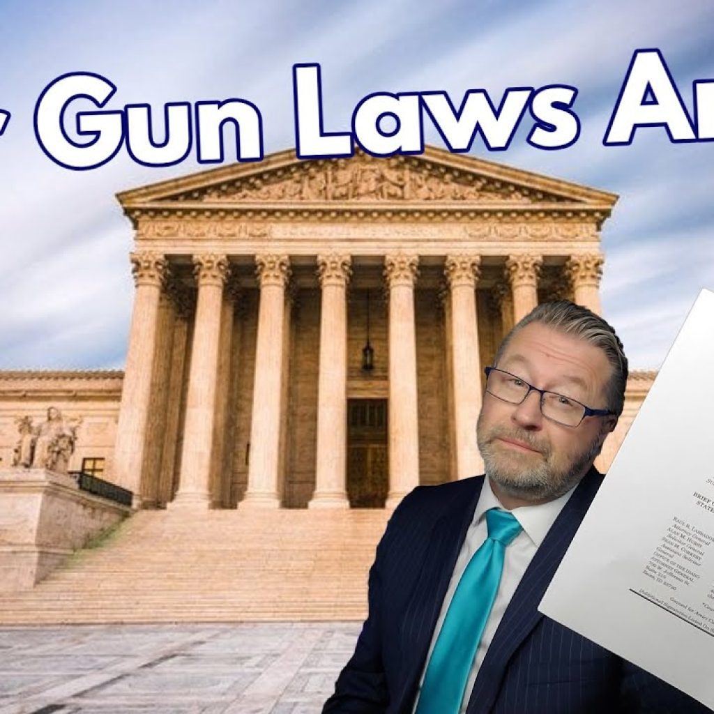 A man in a suit holds up a document titled "Your Laws Are B.S." in front of the U.S. Supreme Court building. Large text above reads "Your Gun Laws Are BS." The WK logo is in the lower left corner.