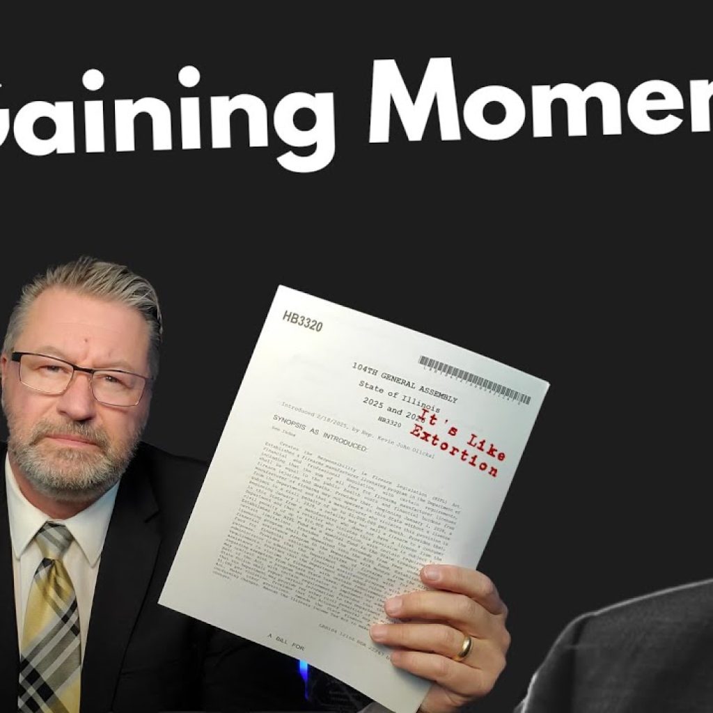 A man in a suit holds up a document with redacted text. Large white text above reads "It's Gaining Momentum." Part of another man's face is visible on the right side. The WK logo appears in the bottom left corner.