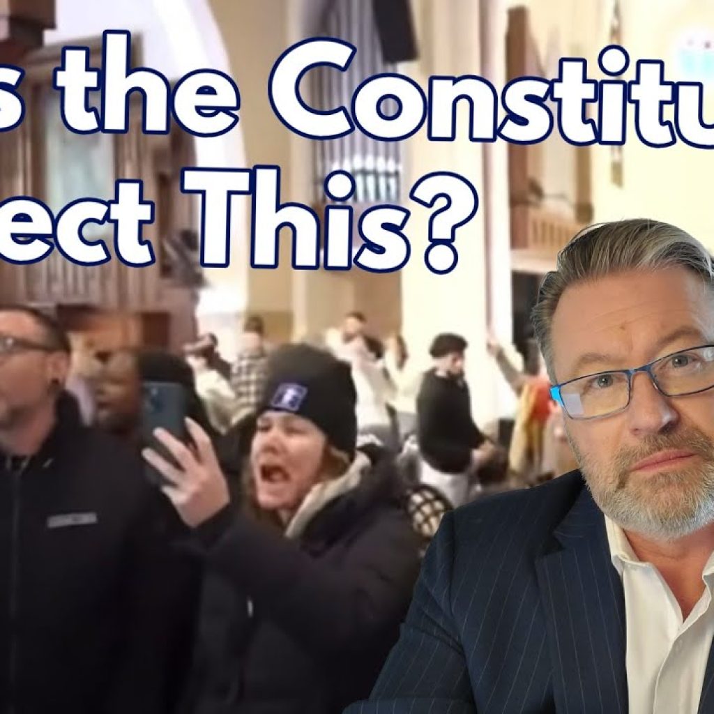 A man in glasses and a suit sits in front of a blurred crowd inside a church. Large text reads, "Does the Constitution Protect This?" The WK logo is in the bottom left corner.