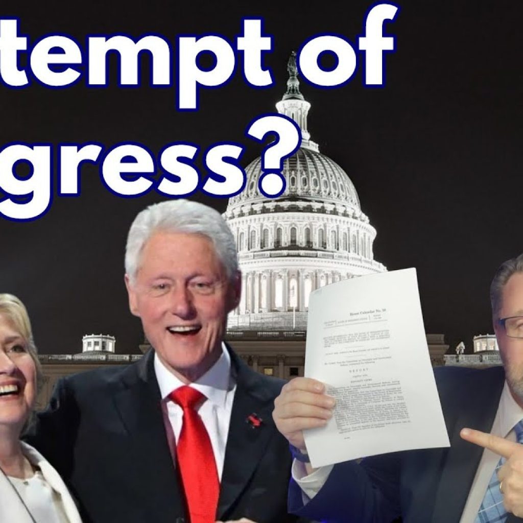 Three people stand in front of the U.S. Capitol at night. Large text reads “Contempt of Congress?” A man on the right holds up and points to a document. A clock is partially visible on the right side.