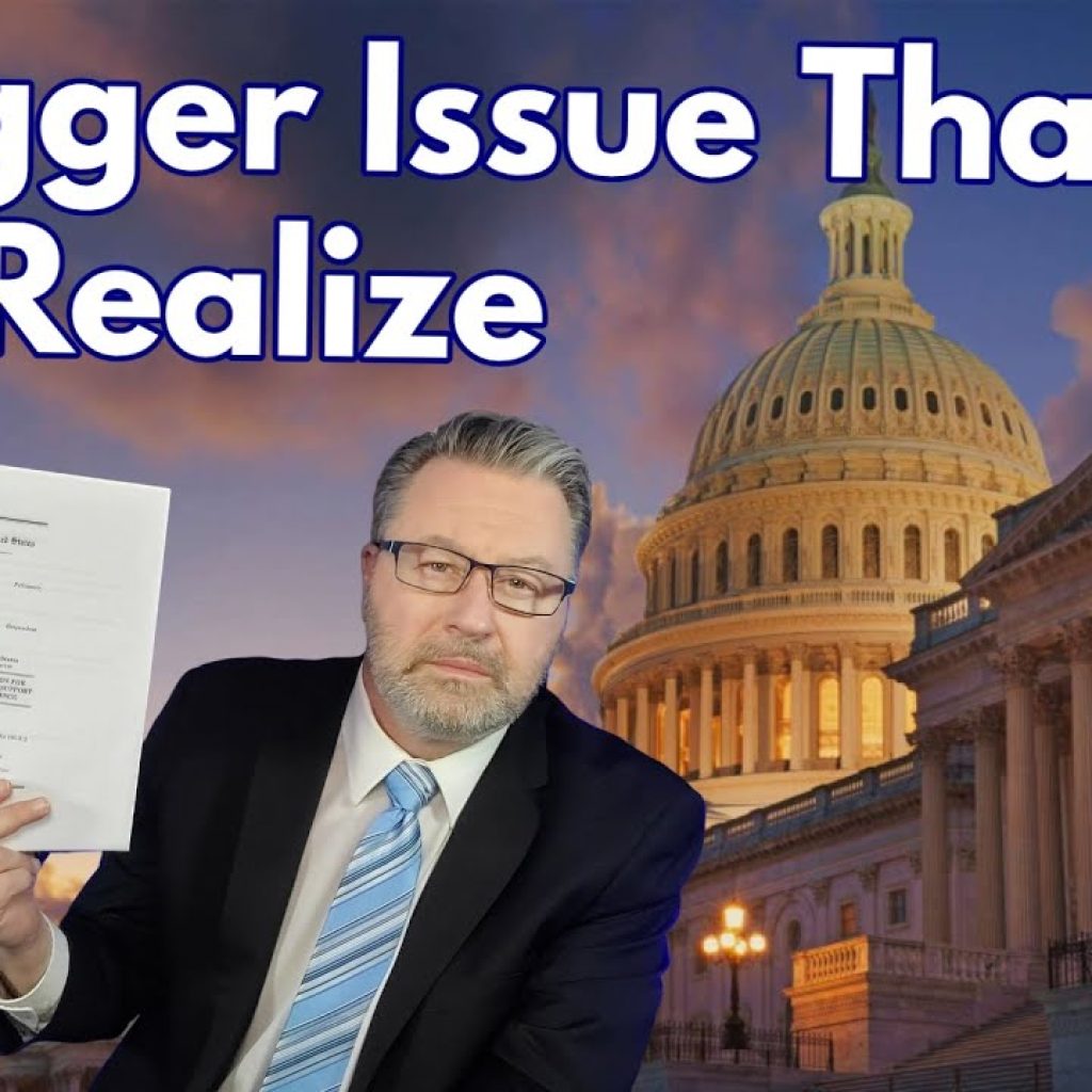 A man in a suit holds up a document in front of the U.S. Capitol building at sunset. Large text reads, "A Bigger Issue Than You Realize." The bottom left corner shows a logo with the letters "WK.