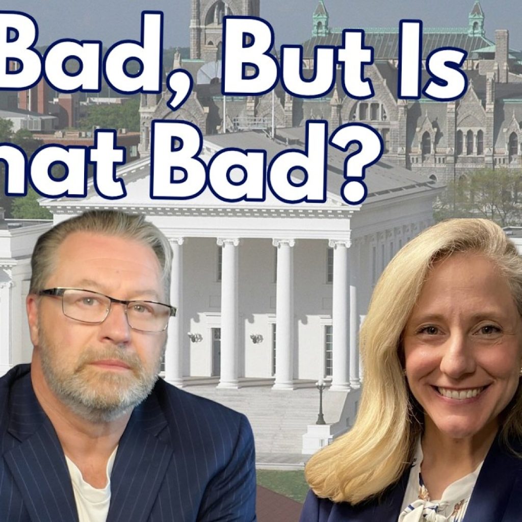 Two people in business attire in front of a government building. Large text above them reads, "It's Bad, But Is It That Bad?" The letters "WK" are in the bottom left corner. The background shows a cityscape.